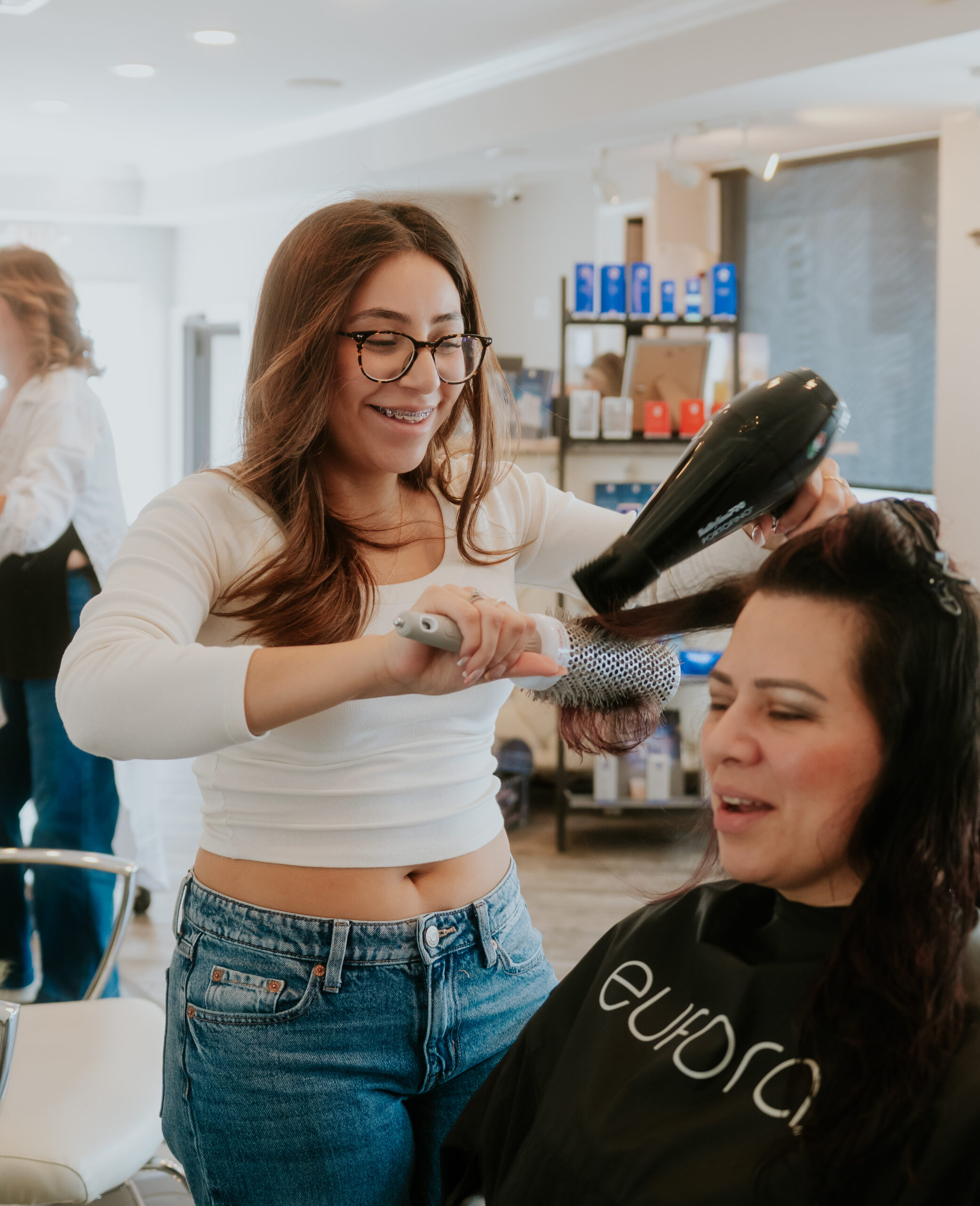 Hair color specialist working with a client at Philip Edward Salon in Boston