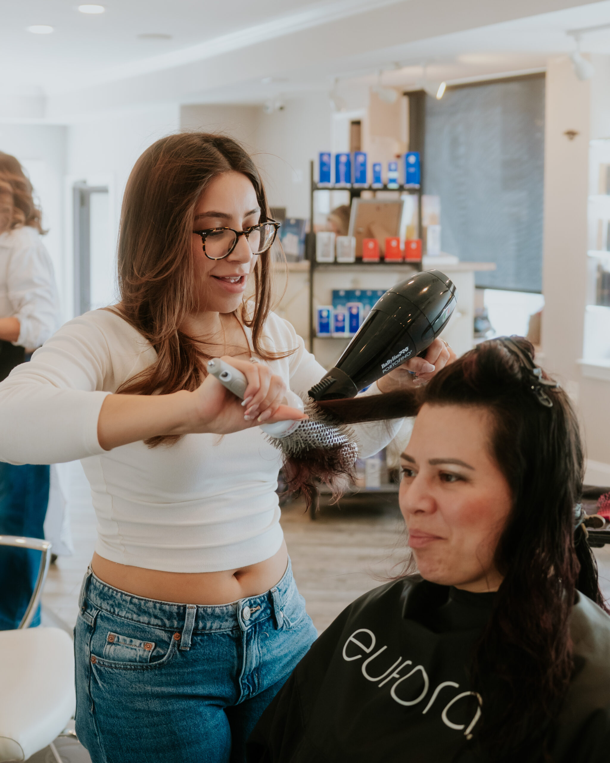 Hair stylist performing blowout service in Charlestown Boston
