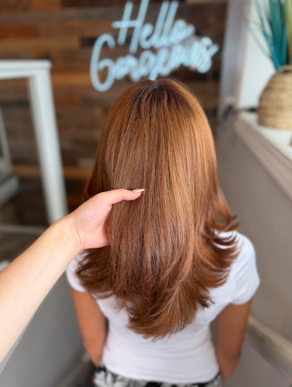 Hair stylist performing blowout service in Charlestown Boston
